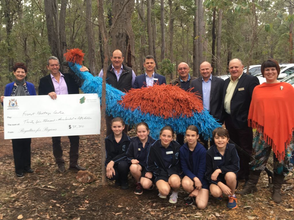 Minister Terry Redman and FHC Chair Sue Fyfe pictured with guests at the relaunch and the cheque for the Emu Walk Trail.